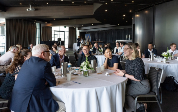 Attendees sitting at a forum.